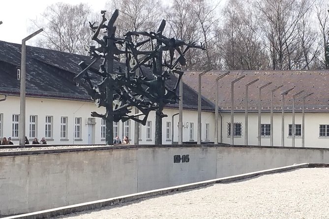 Guided Dachau Concentration Camp Memorial Site Tour with Train from Munich - What the licensed guide does (and why it matters at Dachau)